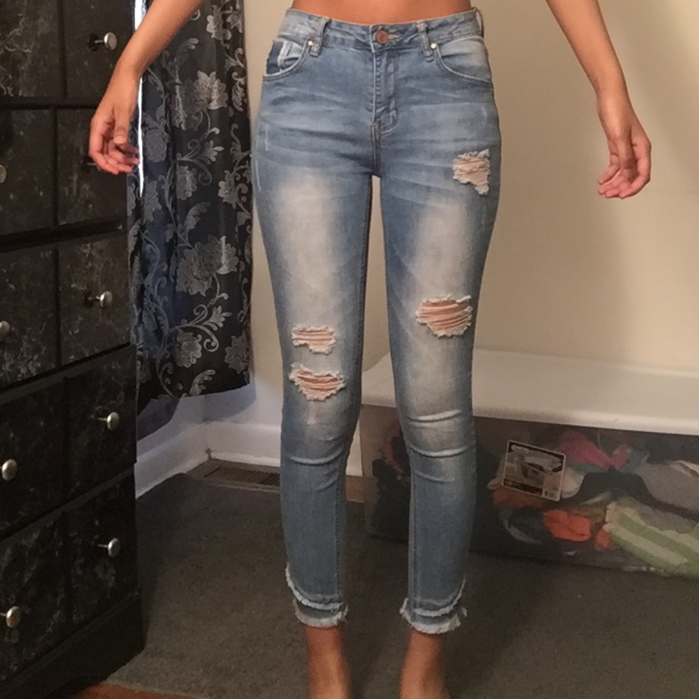 blue ripped and distressed jeans